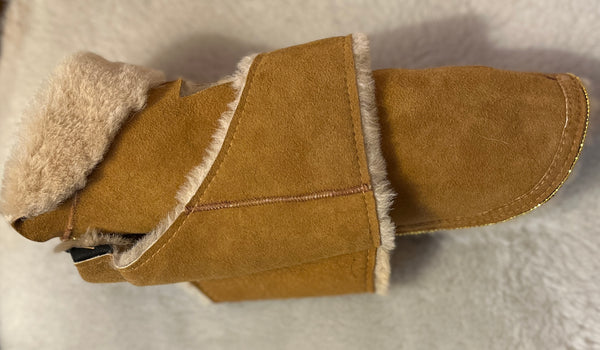 Dog wraps in shearling to Chihuahua with bling