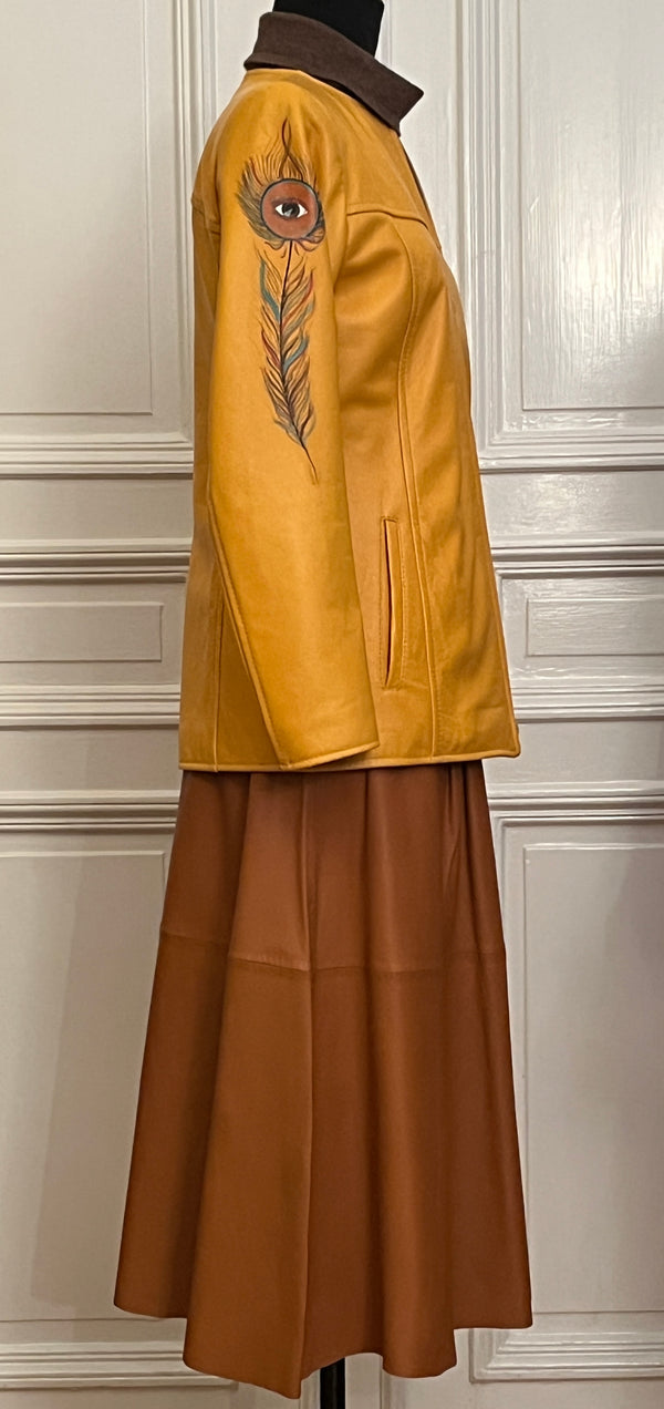 Leather jacket in yellow with a feather painted on it